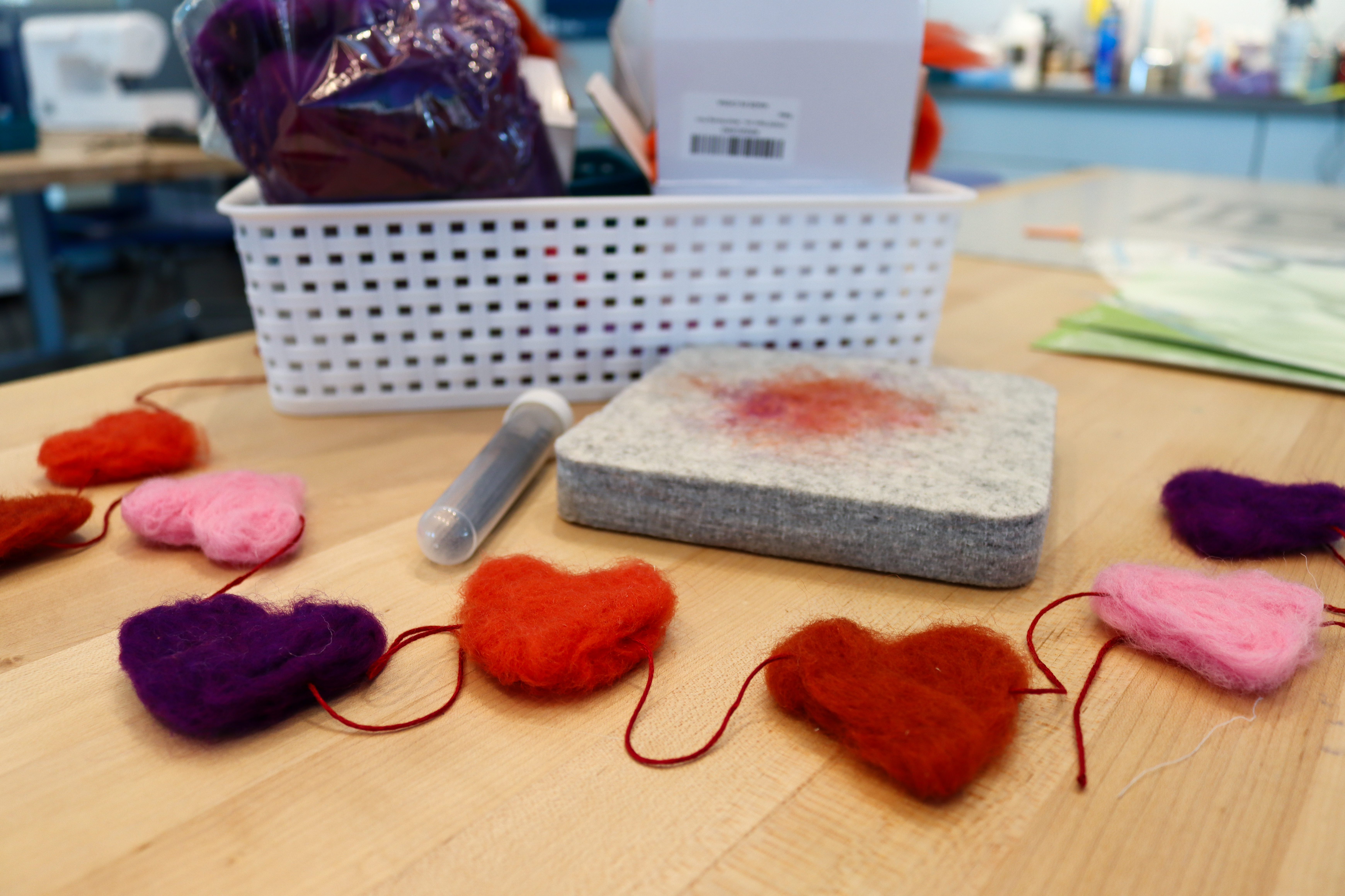 Felt heart garland on a table in Studio 411